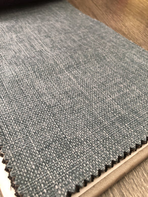 A piece of burlap fabric in Citadel gray, with a clearly texture